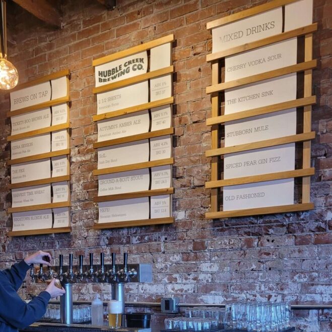 Just off the gentle buzz of Main Street, nestled next to a laundromat with the faint scent of soap in the air, Hubbell Creek Brewing is more than a brewery—it's a heartbeat of community life. Inside, you'll find exposed brick, warm lighting, and a cozy layout that welcomes both familiar faces and curious newcomers.